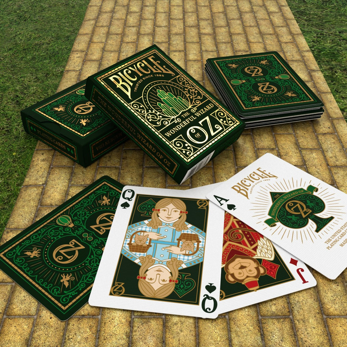 Bicycle Oz playing cards on a stone surface with grass in the background