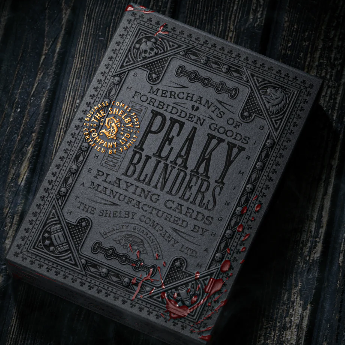 Peaky Blinders playing cards on a dark textured background