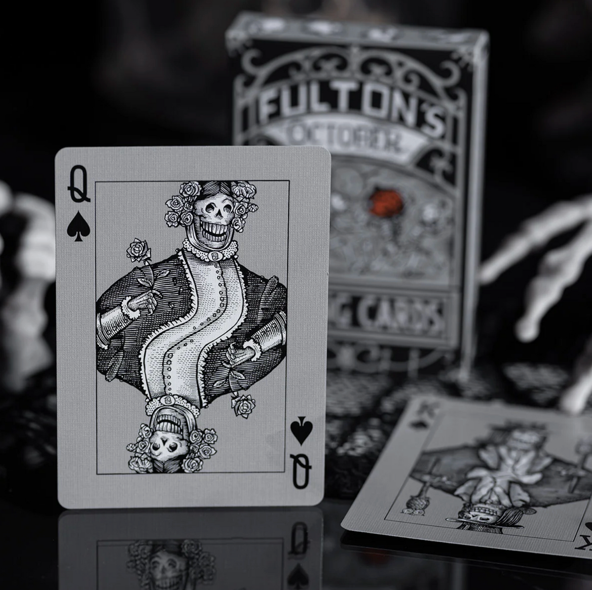 Playing card with a skeleton design on a dark background