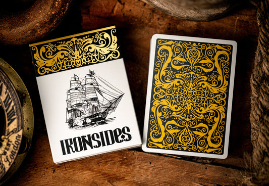 Playing cards with 'Ironsides' design on a wooden surface