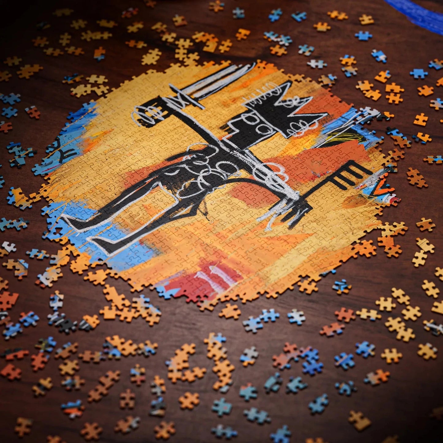 Jigsaw puzzle with a partially completed design of a horse and rider on a wooden surface.