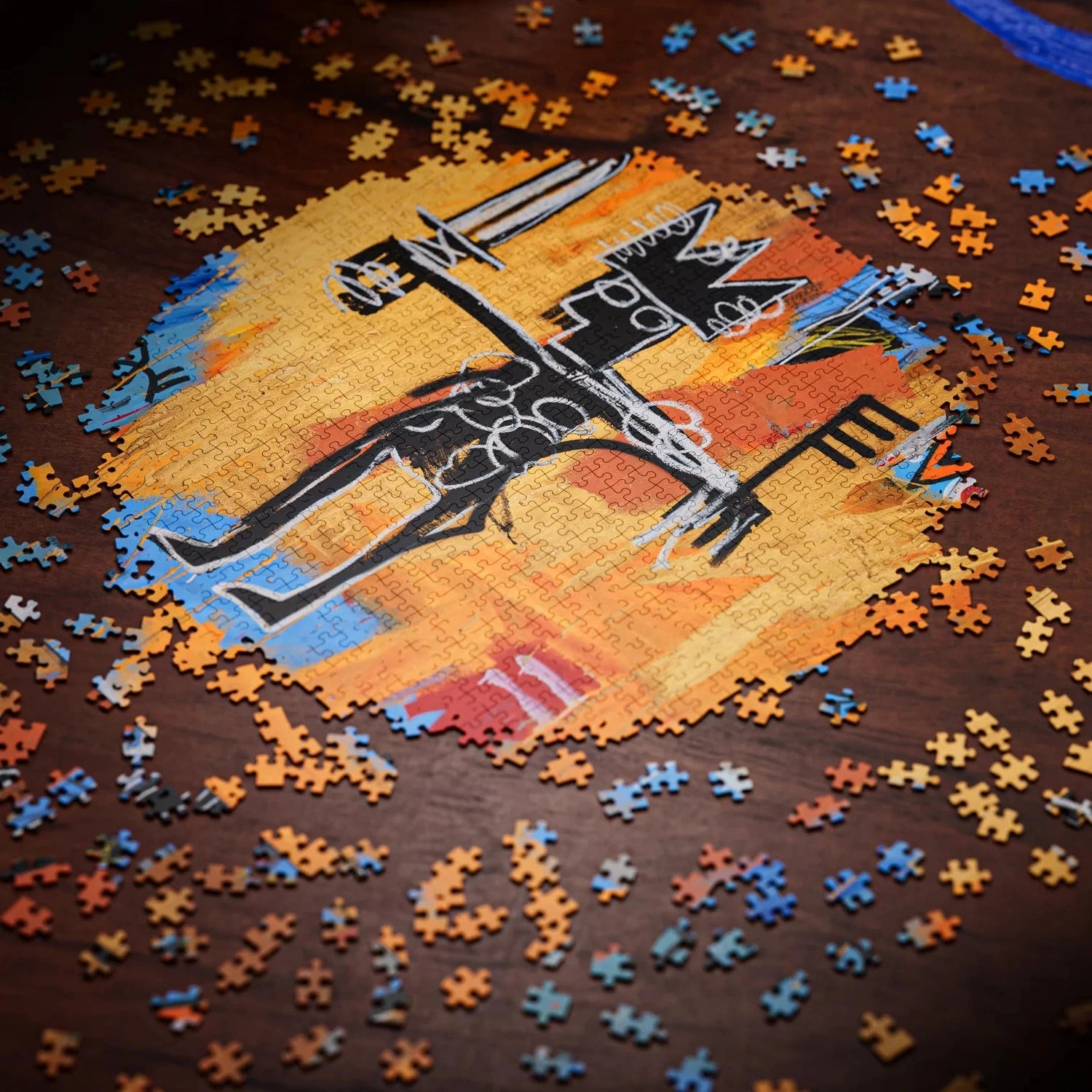 Jigsaw puzzle with a partially completed design of a horse and rider on a wooden surface.