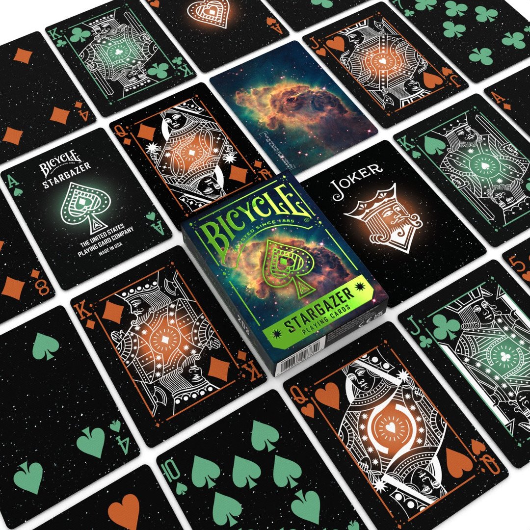 Bicycle Stargazer playing cards with a box in the center, surrounded by various card designs.