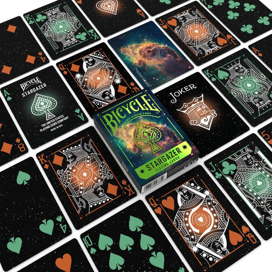 Bicycle Stargazer playing cards with a box in the center, surrounded by various card designs.