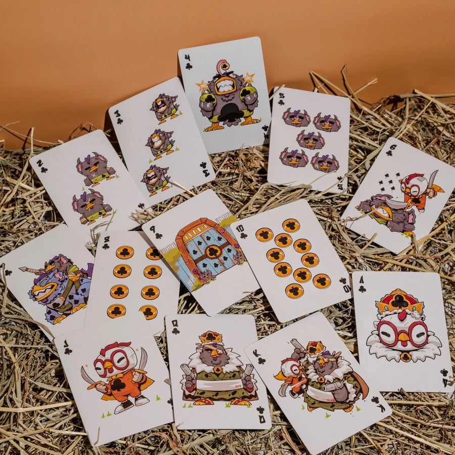 Playing cards with cartoonish animal designs on a straw background