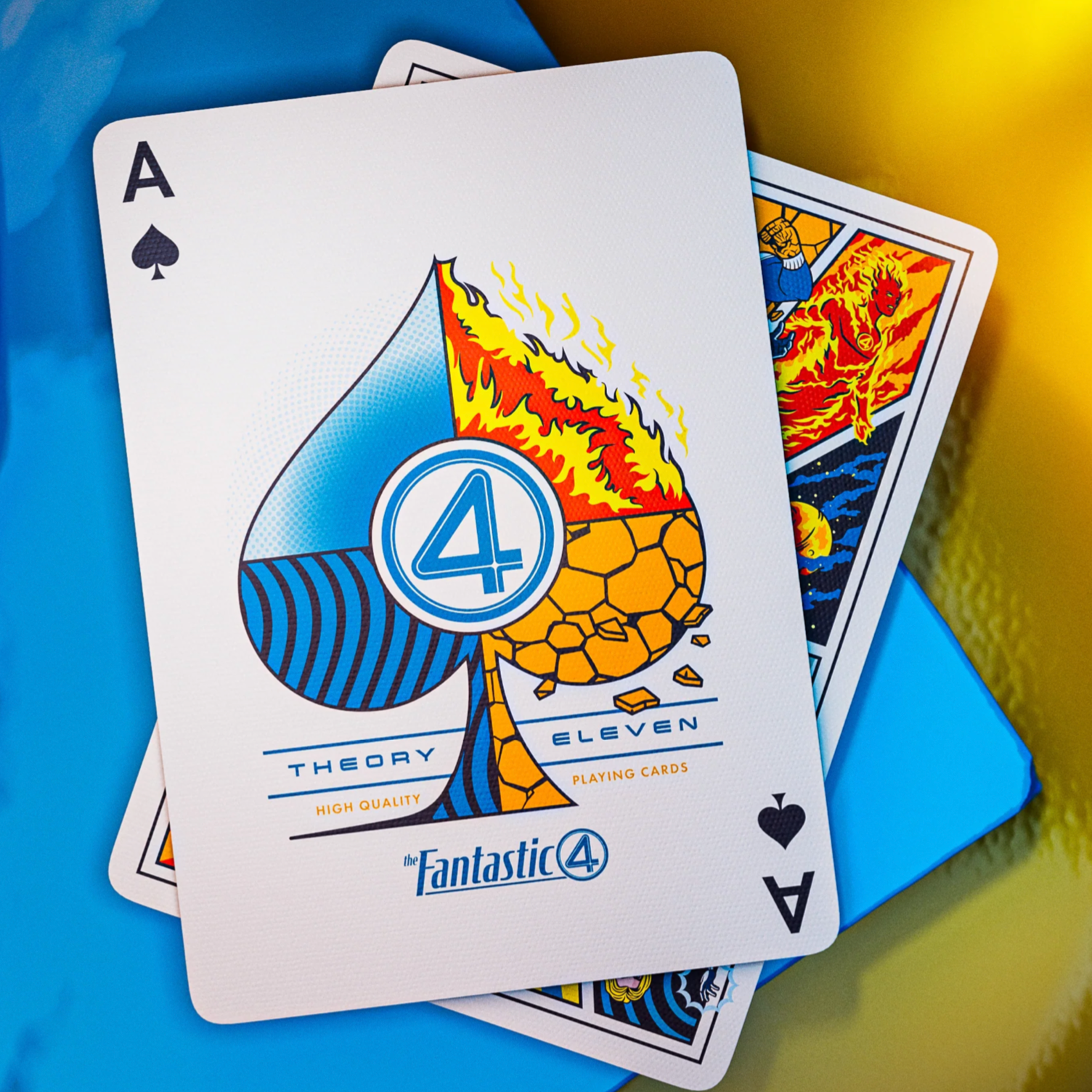 Playing cards with 'Fantastic Four' design on a blue and yellow background