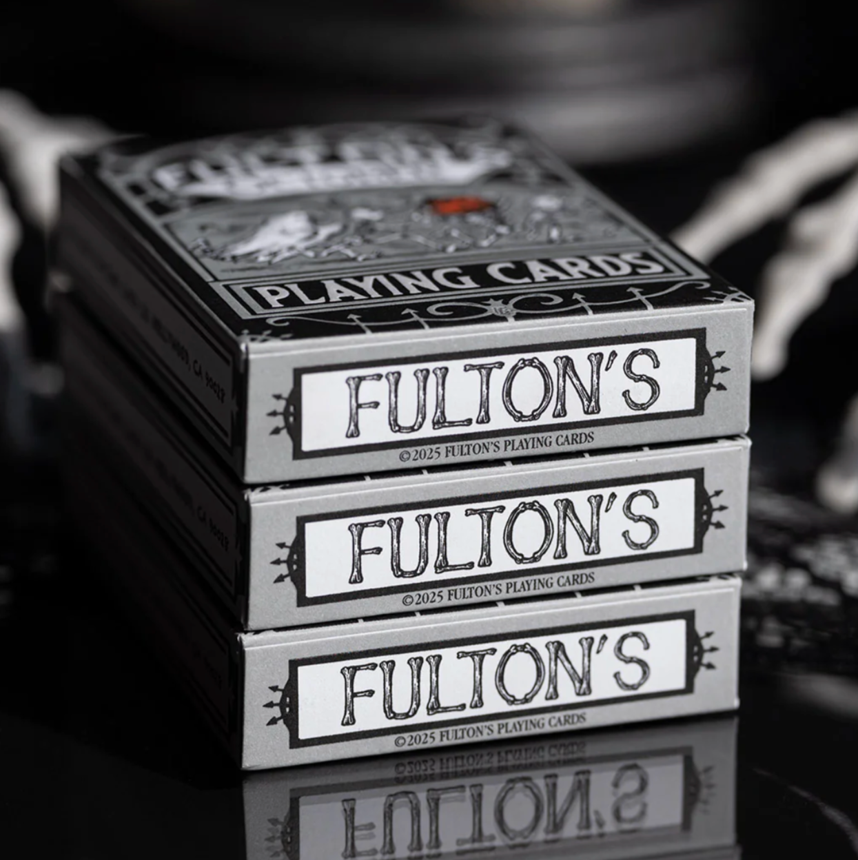 Stack of Fulton's playing cards with a blurred background