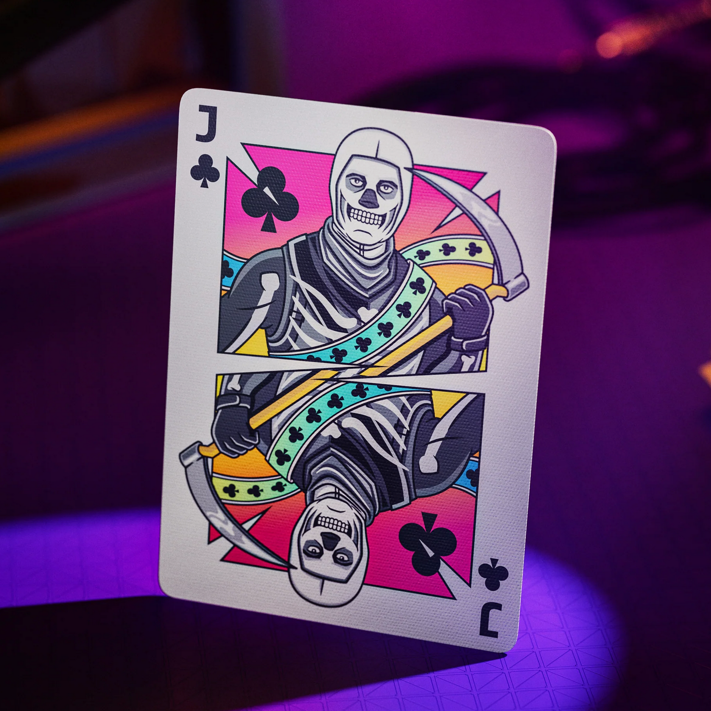 Playing card with a skeleton design on a purple background