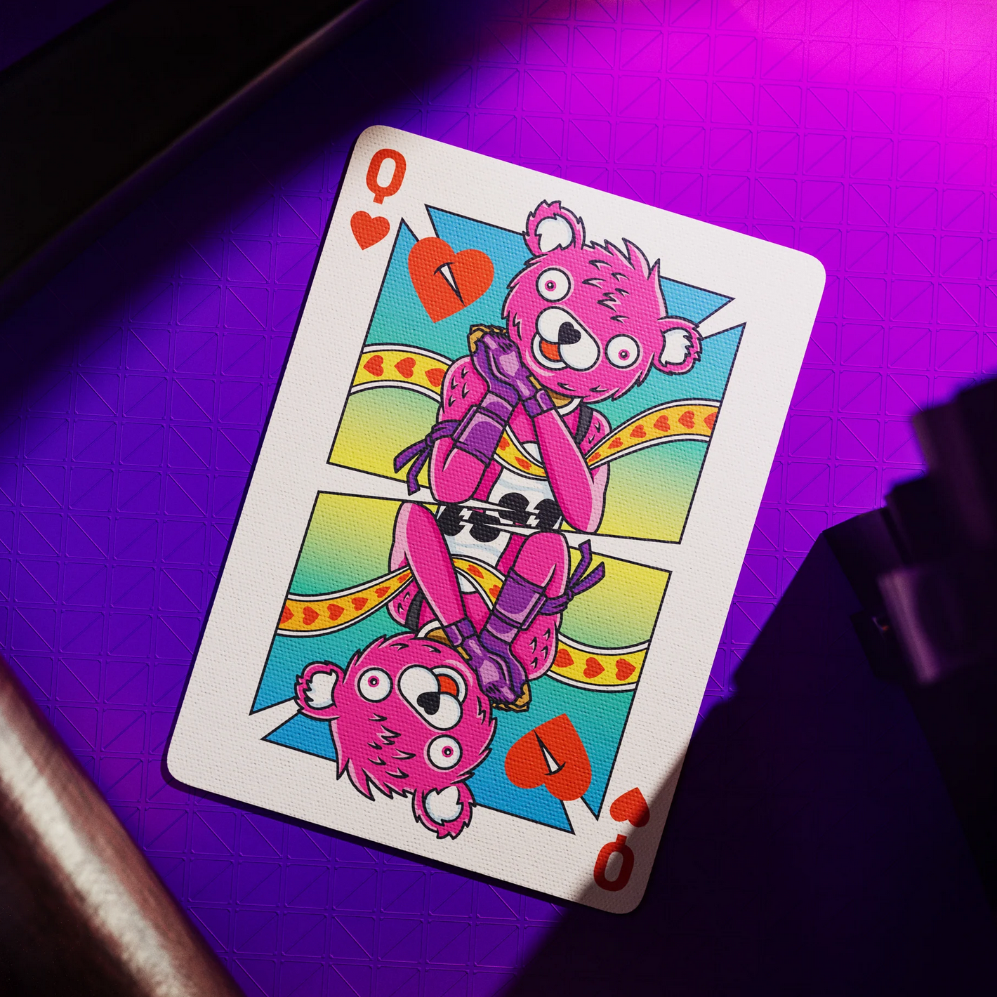 Fortnite Playing card with a pink bear design on a purple surface