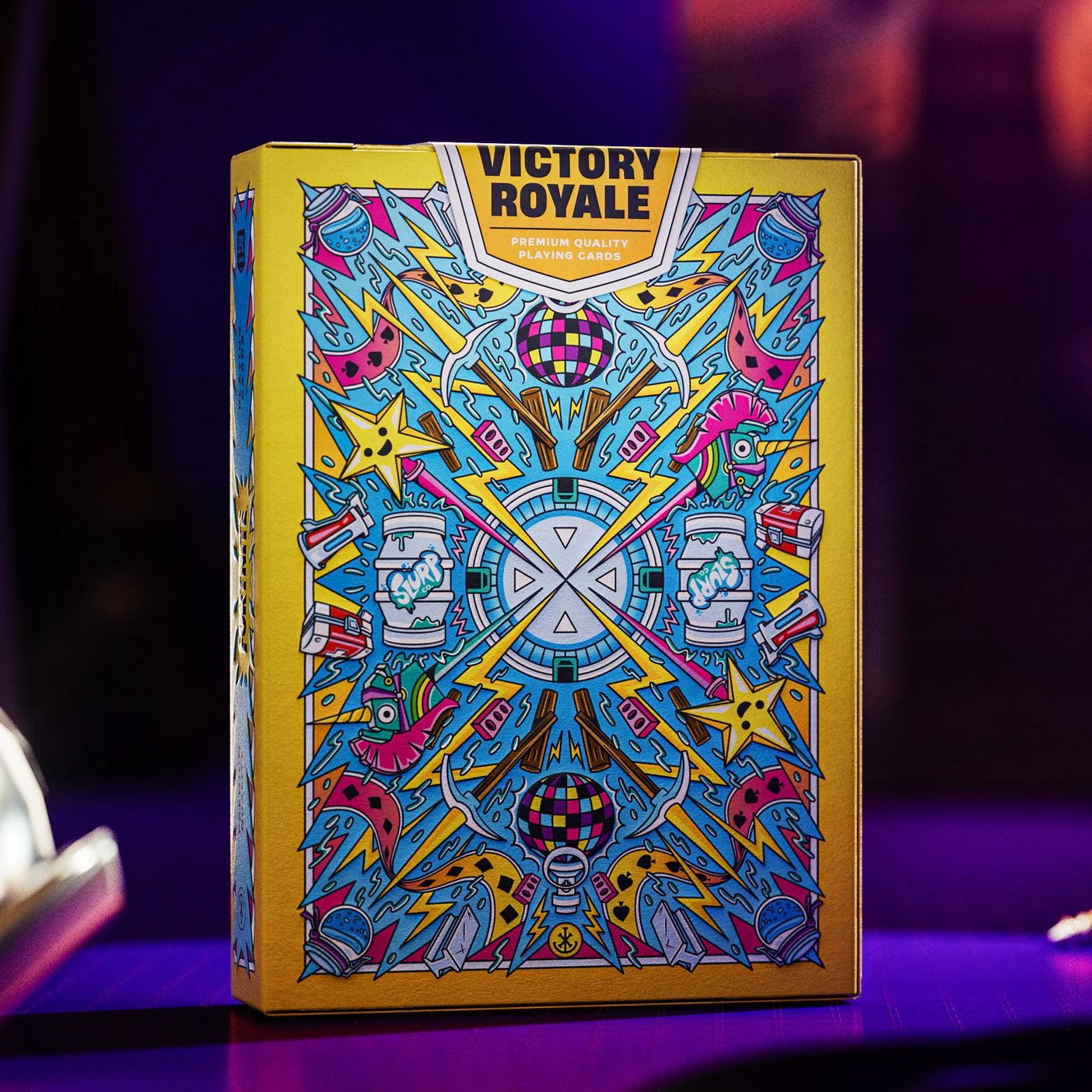 Colorful Fortnite card game box with 'Victory Royale' text on a dark background