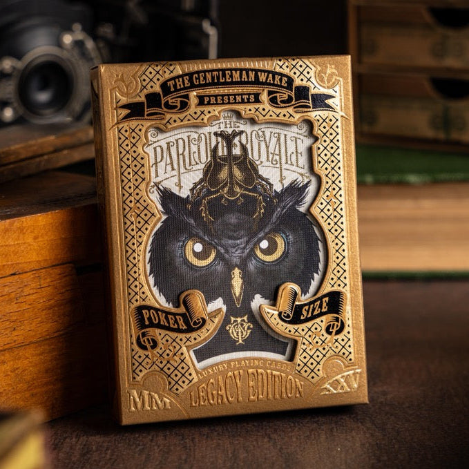 Poker playing cards with owl design on a wooden surface