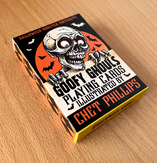 Card deck packaging with a skull design on a wooden surface