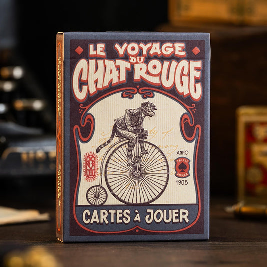 Le Voyage du Chat RougePlaying card box with vintage design featuring a cat on a bicycle