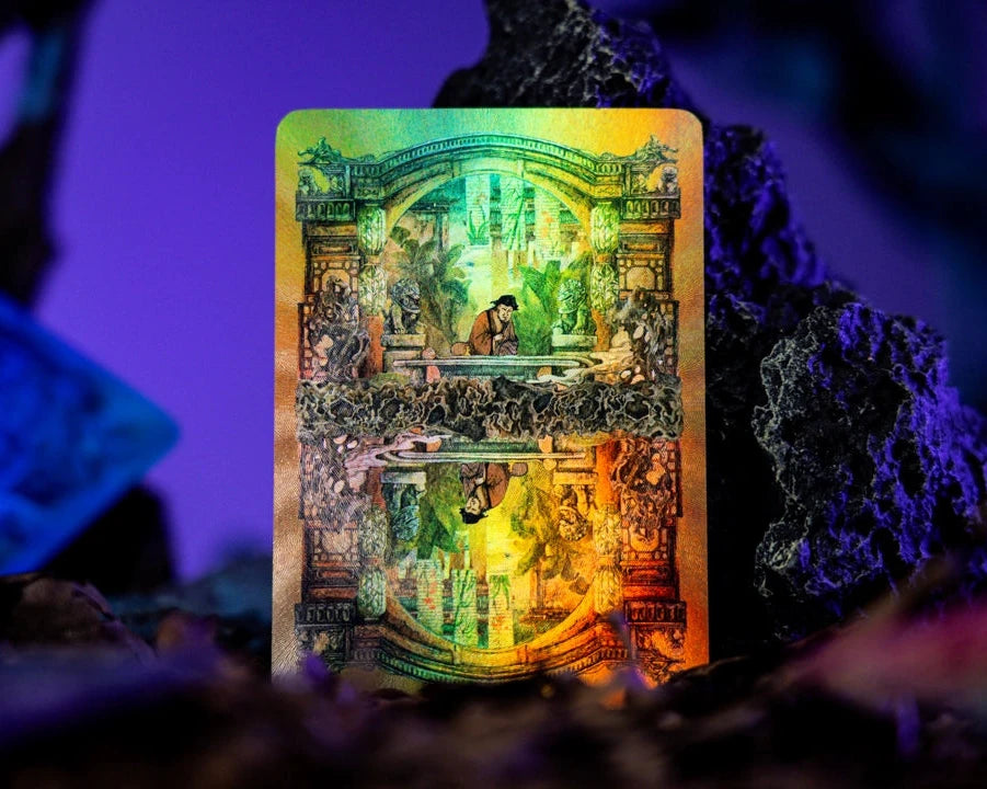 A tarot card featuring an ornate golden and green illustration of a knight in armor, standing upright on dark rocks with a purple-lit background.