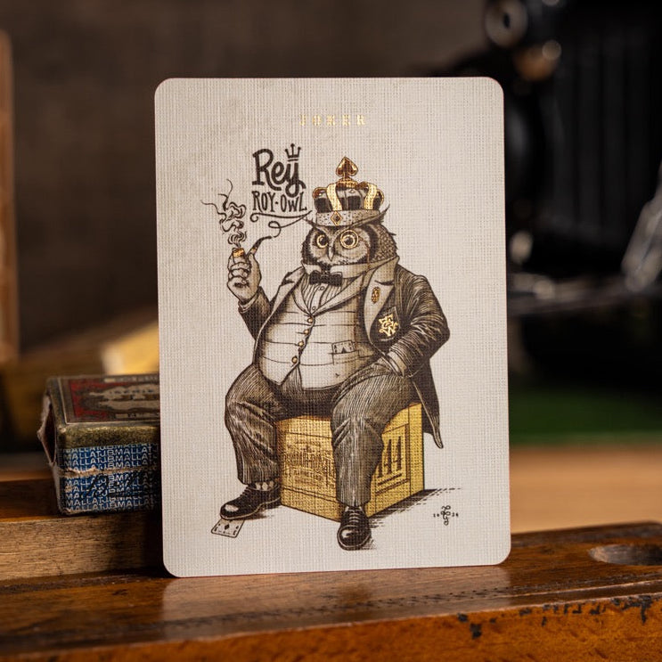 Vintage-style card with a character in a suit and crown on a wooden surface