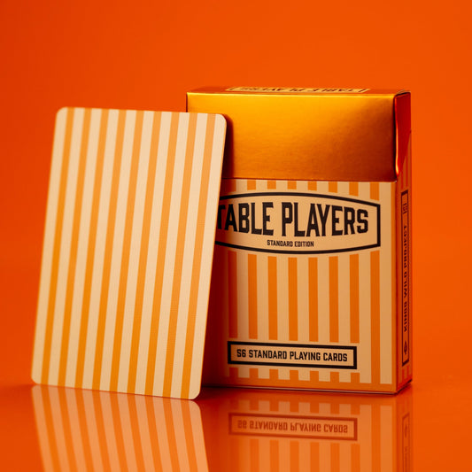 Playing cards with striped design and 'Table Players' branding on an orange background