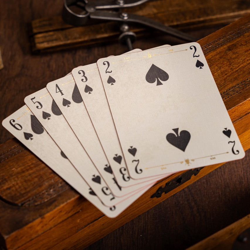 Playing cards on a wooden surface with a vintage feel