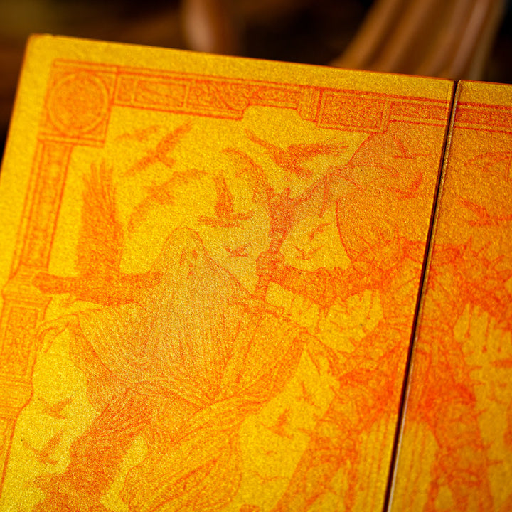 Decorative wooden box with intricate carvings on a dark background