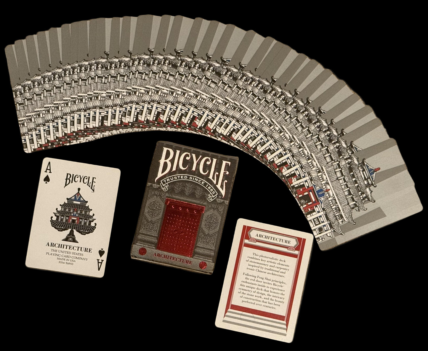Bicycle Architecture playing cards fanned out on a beige surface with two cards displayed.