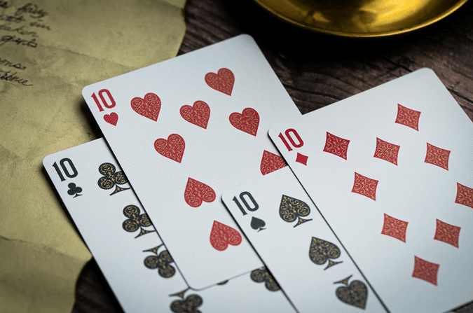 Devil's in the Details - Rose Gold in Leather Pouch Playing Cards by Riffle Shuffle Playing Card Company